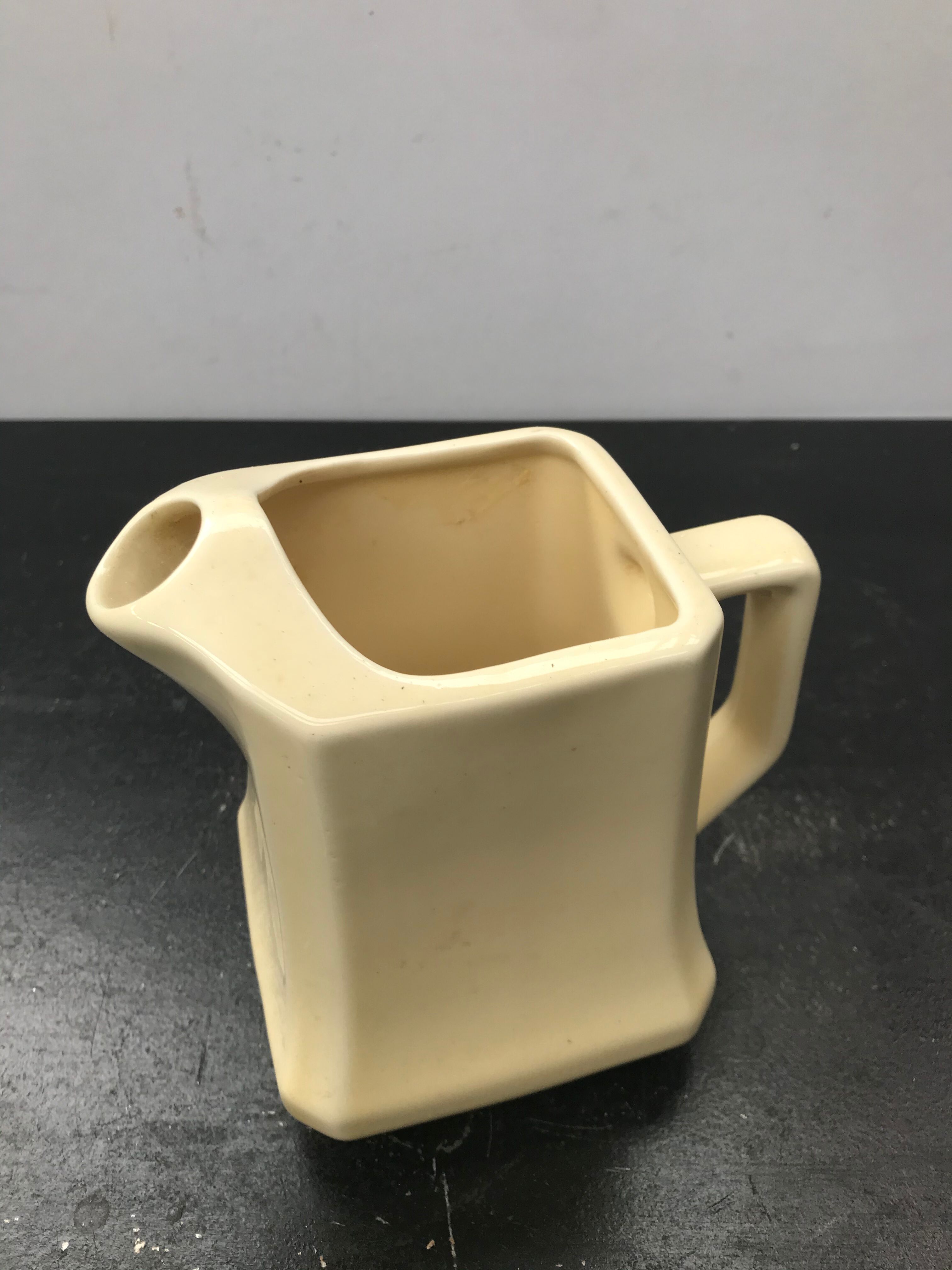 Former beige ceramic pitcher 70