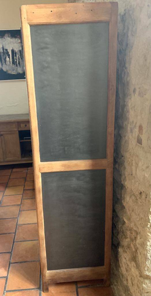 Vintage wooden wardrobe with matte cast iron color hanging rail