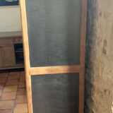 Vintage wooden wardrobe with matte cast iron color hanging rail