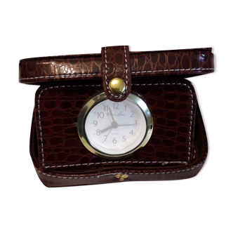 Small travel alarm clock in its case with jewelry compartments