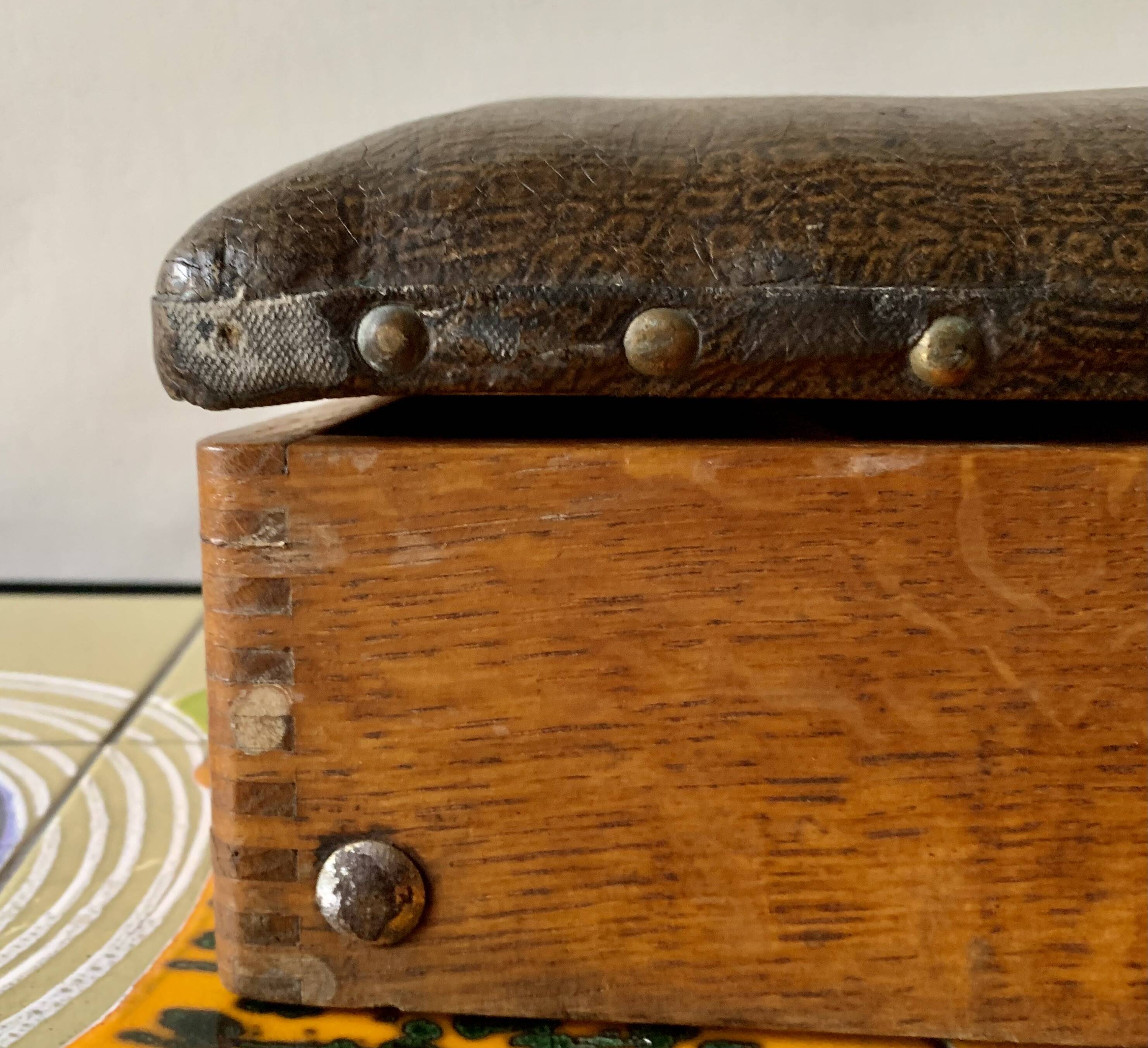 Old foldable fisherman's stool in wood and leather