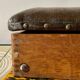 Old foldable fisherman's stool in wood and leather