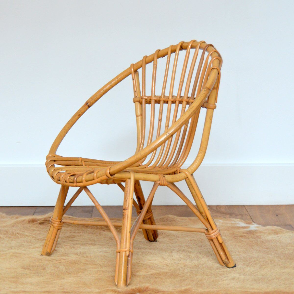 Children's shell armchair in rattan 1960s