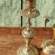 Pair of chiseled brass candle holders