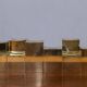 Group of cubic solid brass candlesticks by Gusum Metallslöjden, Sweden