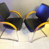 Chairs in leather, walnut and chrome