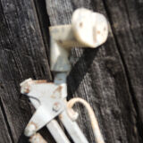 Old articulated workshop lamp in painted metal