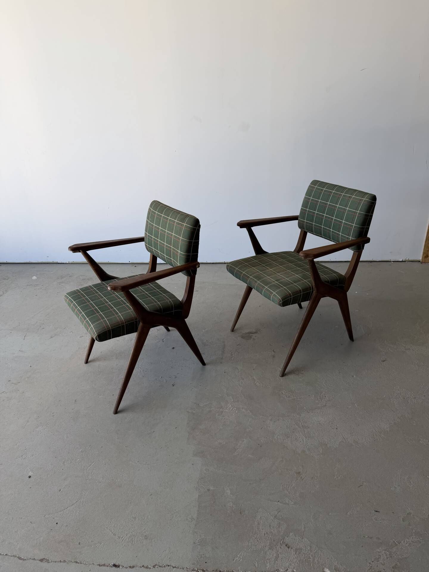 Pair of armchairs with a Scandinavian design in vintage teak from the 1960s.