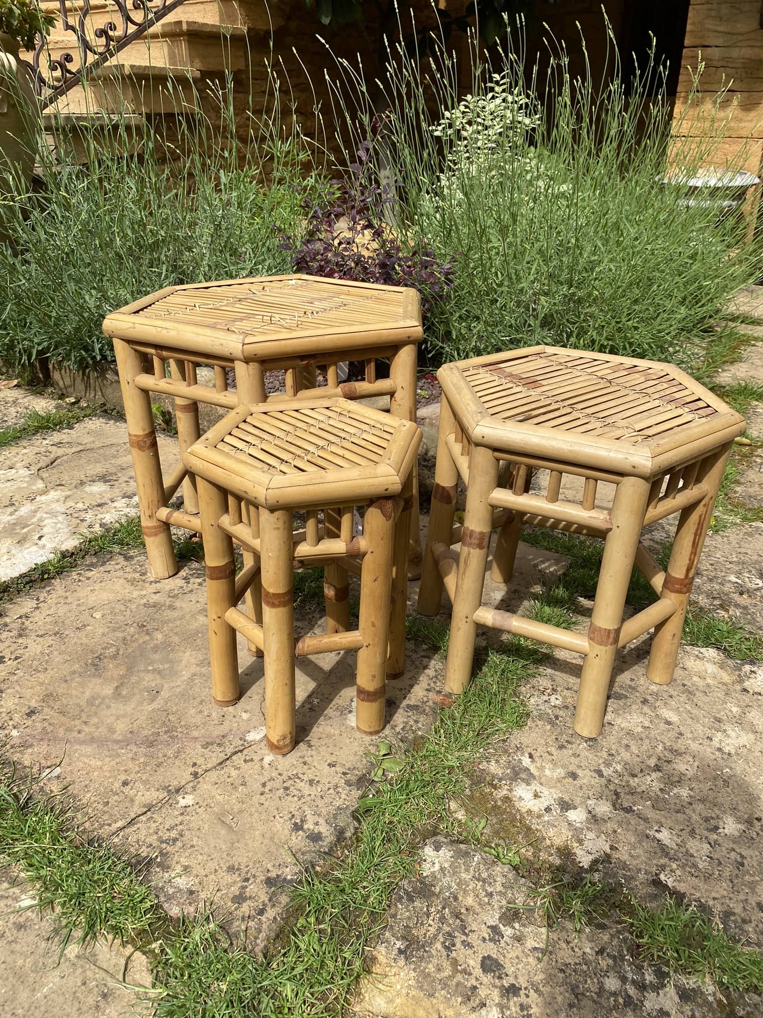 Set of three vintage rattan side tables.