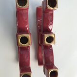 Former pair of burgundy ceramic candlesticks