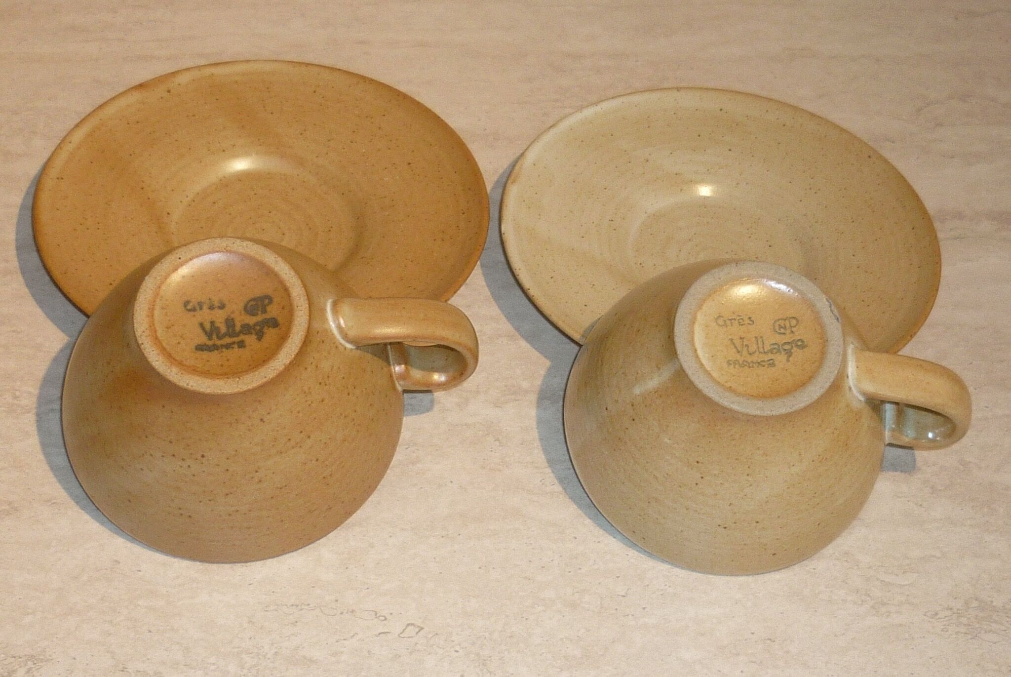 CNP Village stoneware cups and sub-cups