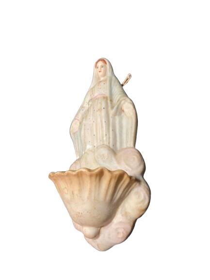 Ceramic holy water font with a representation of a woman