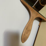 Old beveled hand mirror and wooden frame