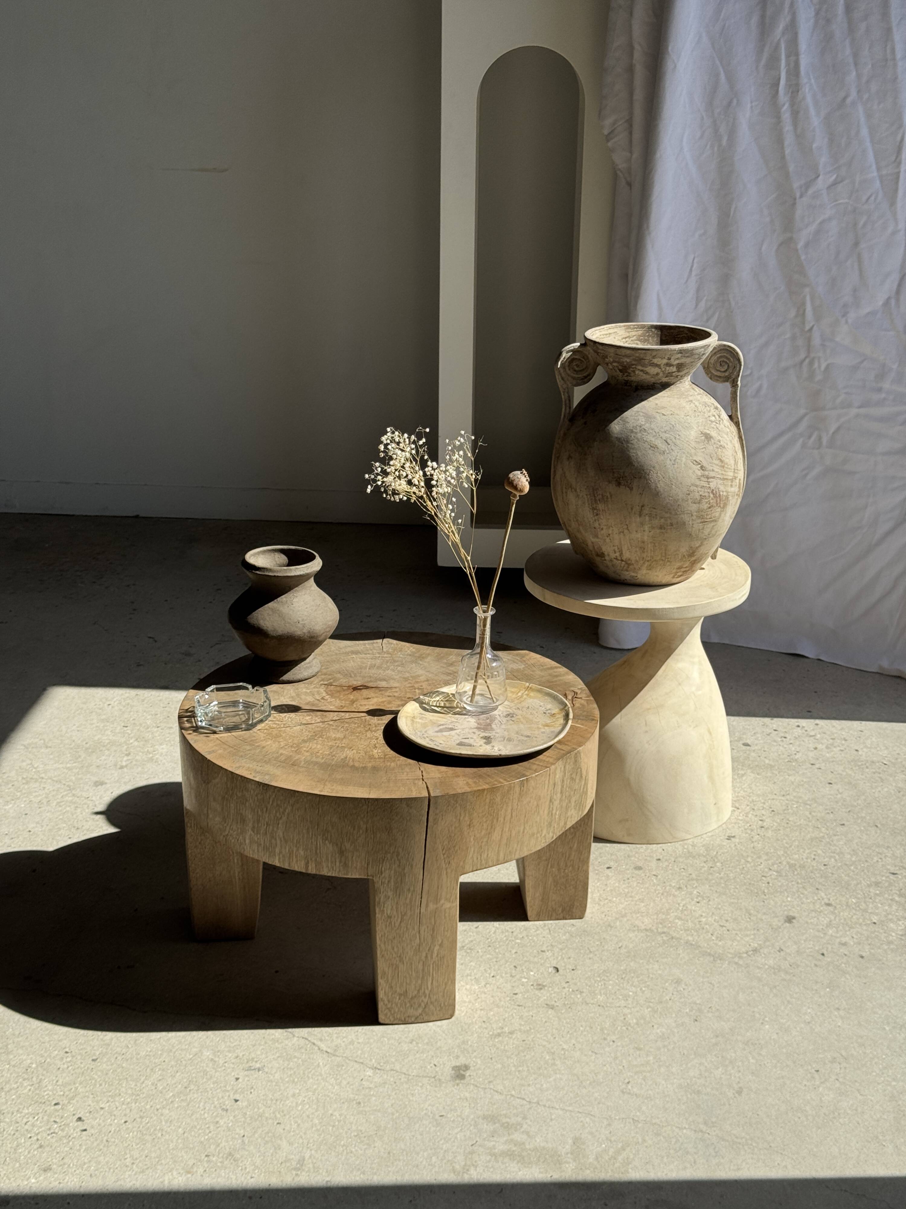 Petrified wood catchall or dish in beige with several grey spots in the centre.