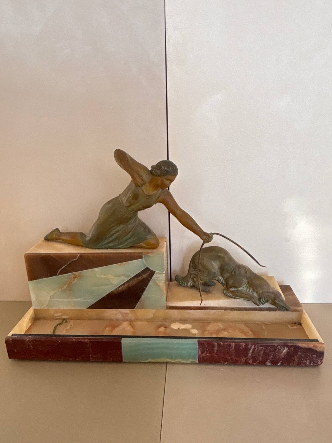 Sculpture of a woman with a greyhound