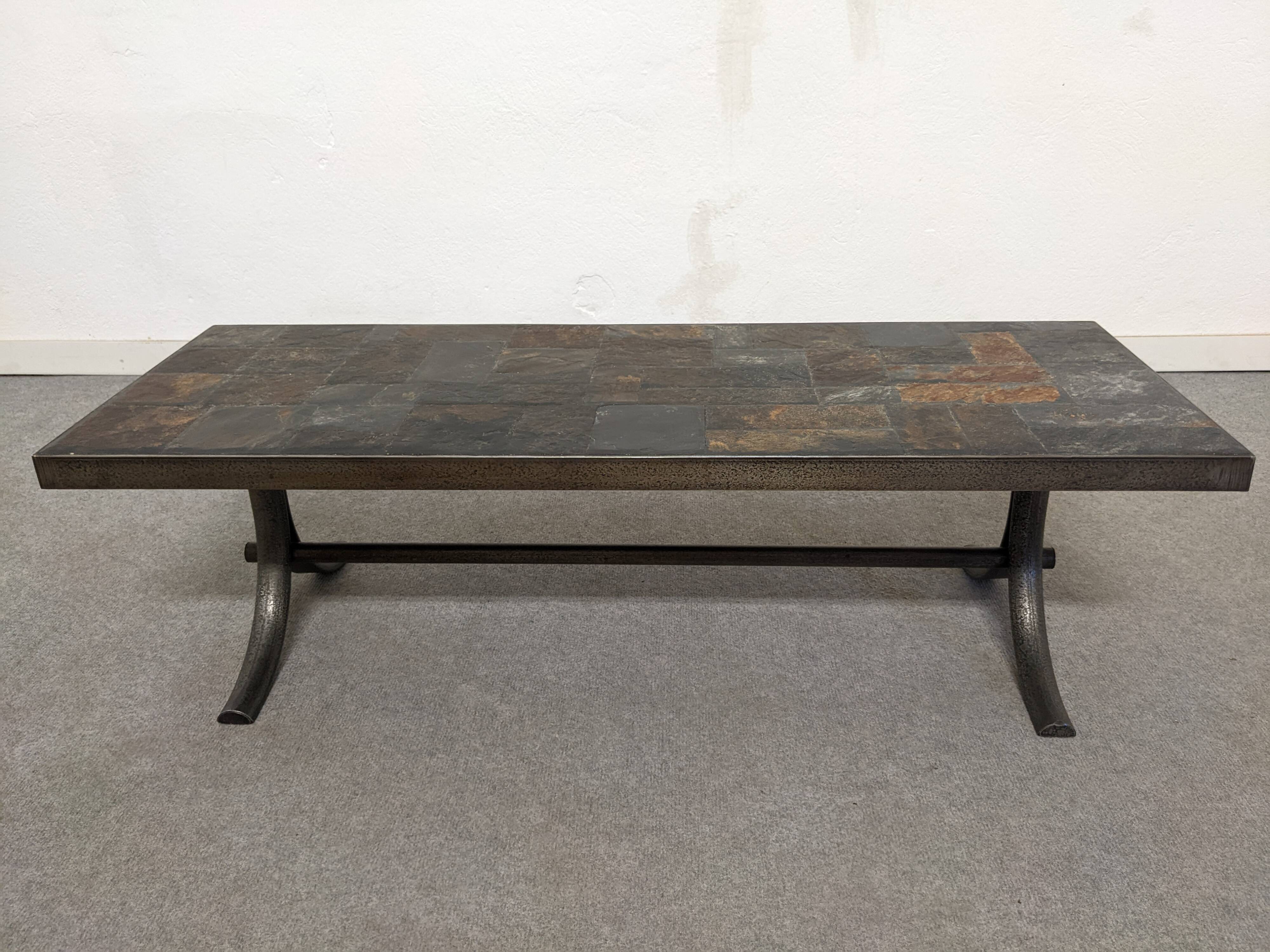 Brutalist coffee table in natural stone and wrought iron, France circa 1960.