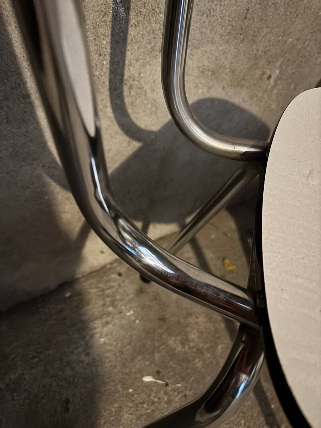 3 white Formica chairs
