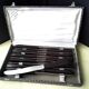 Box of 12 vintage table knives in stainless steel and brown bakelite