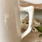 Old white earthenware jug