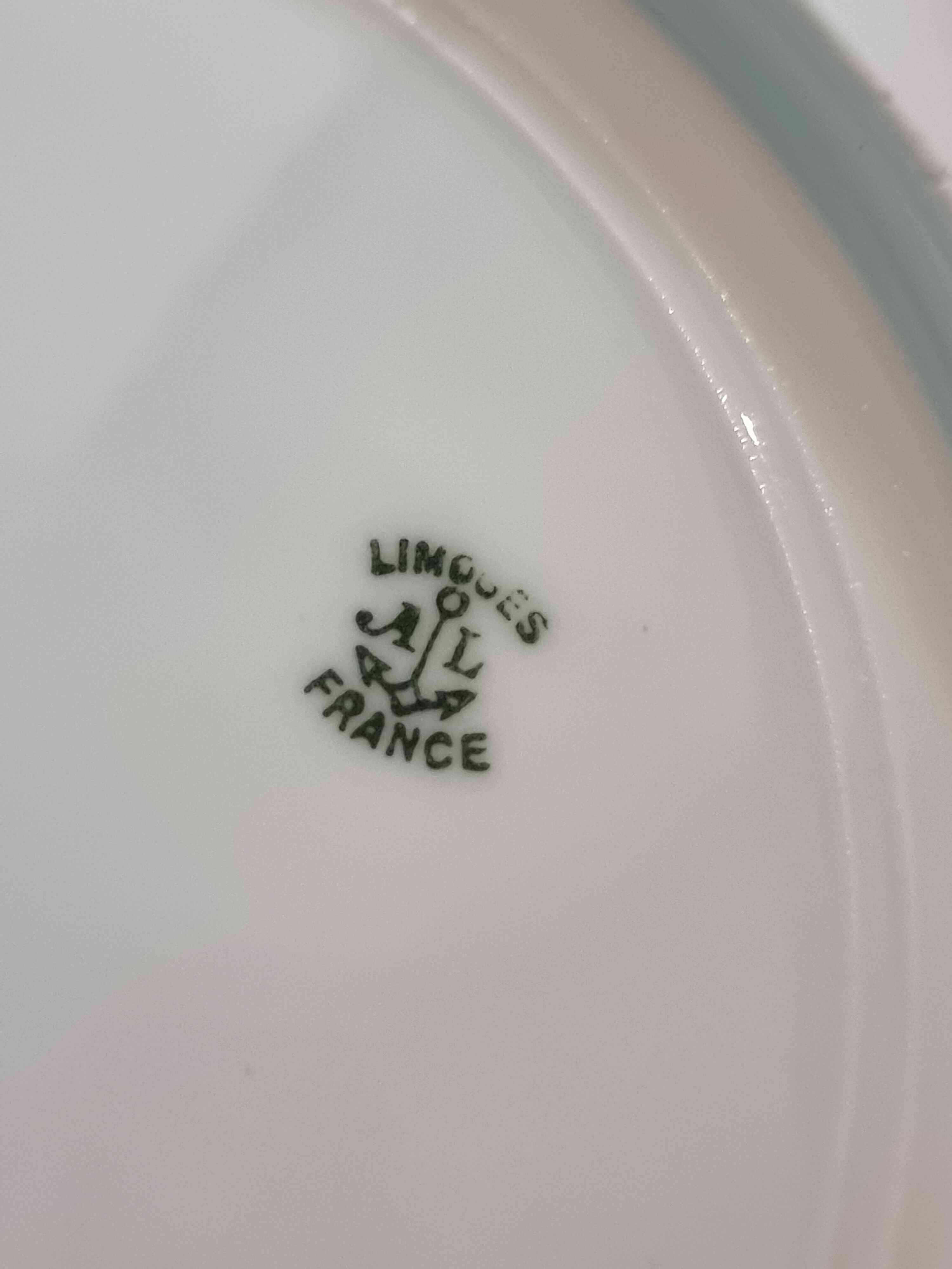 Set of eight Limoges porcelain plates