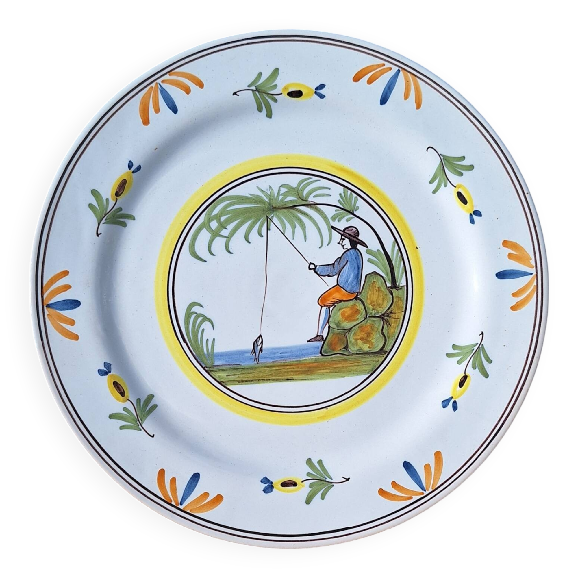 Assiette en faïence à décor de pecheur