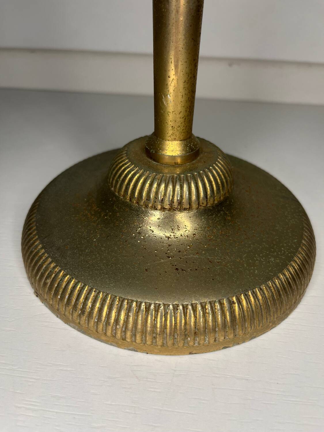 Vintage brass floor ashtray with glass shelf in Empire style.