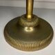 Vintage brass floor ashtray with glass shelf in Empire style.