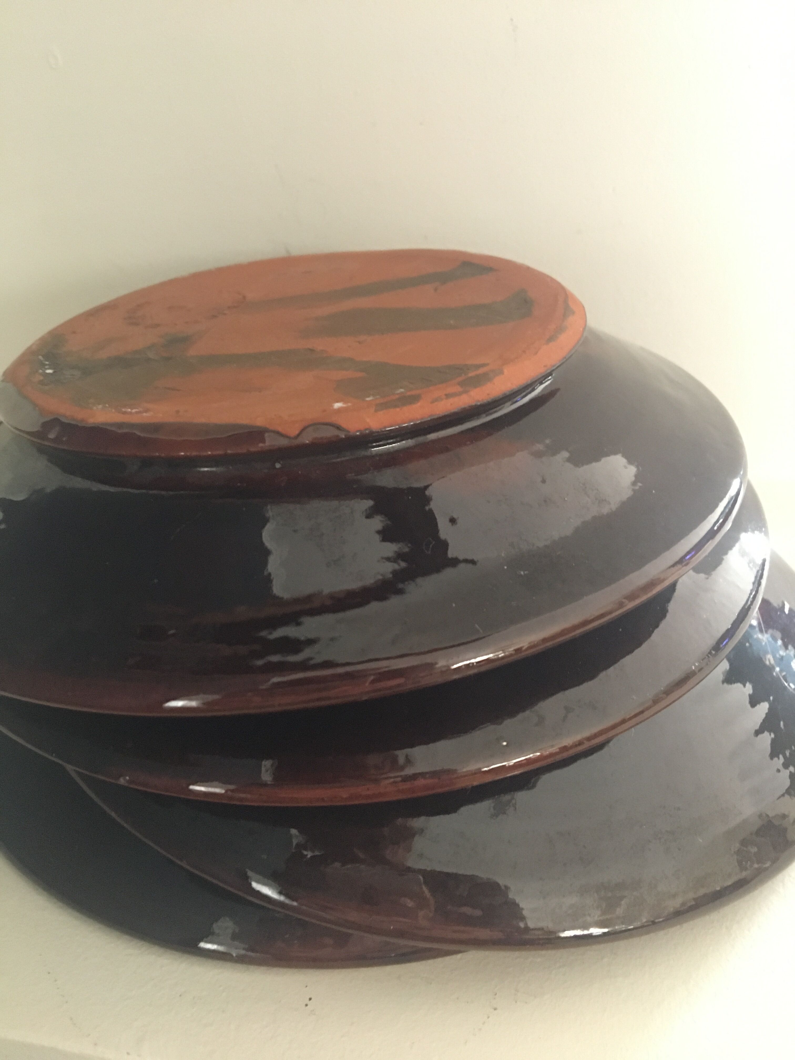Four decorated ceramic plates