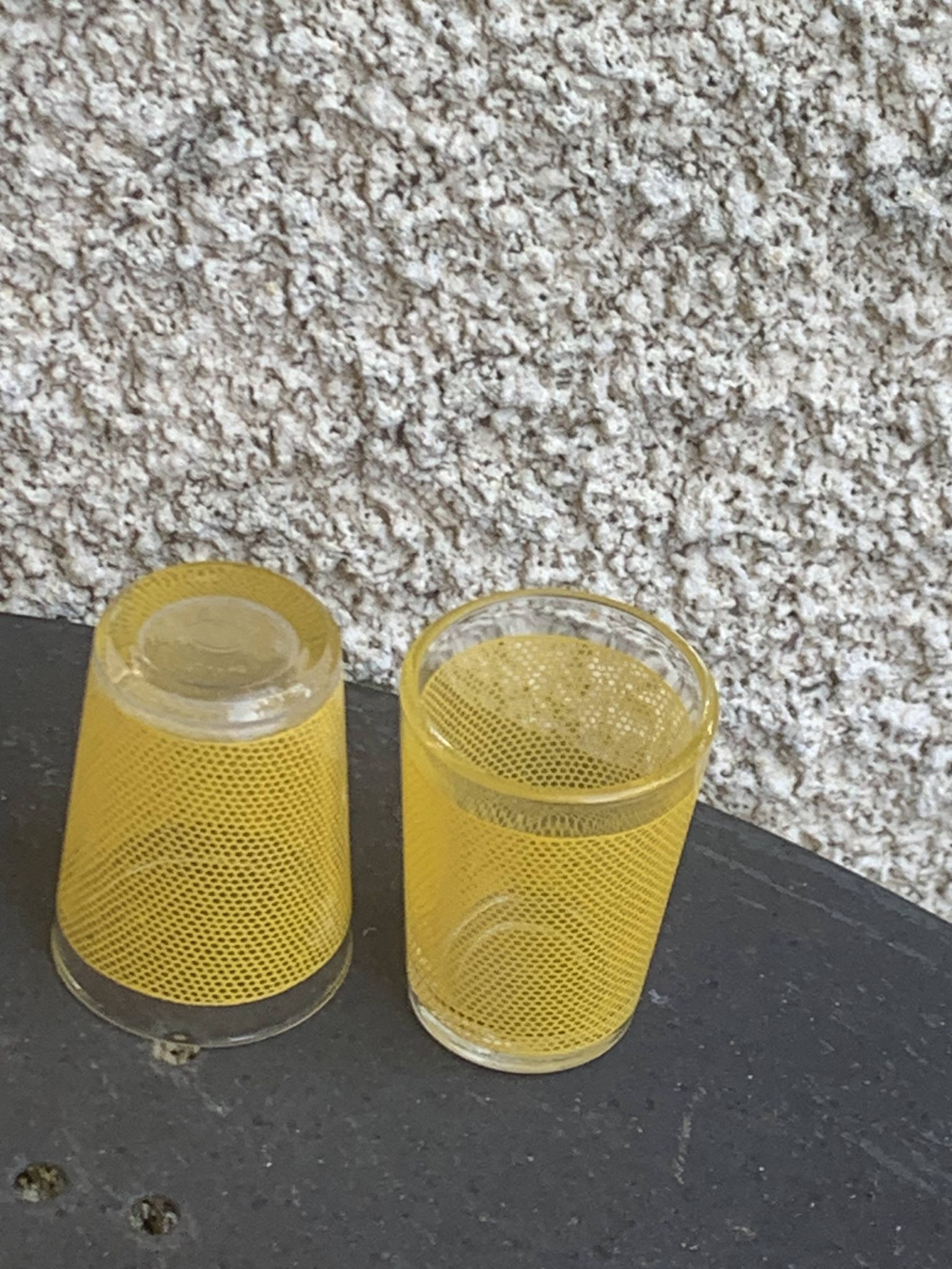 Liqueur set consisting of a glass carafe and 8 small yellow glasses