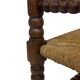 Vintage 'bobbin' bench with a rush seat, 1920s design with armrests.
