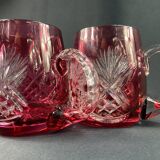 Pair of cut and red tinted crystal beer mugs signed Etzel