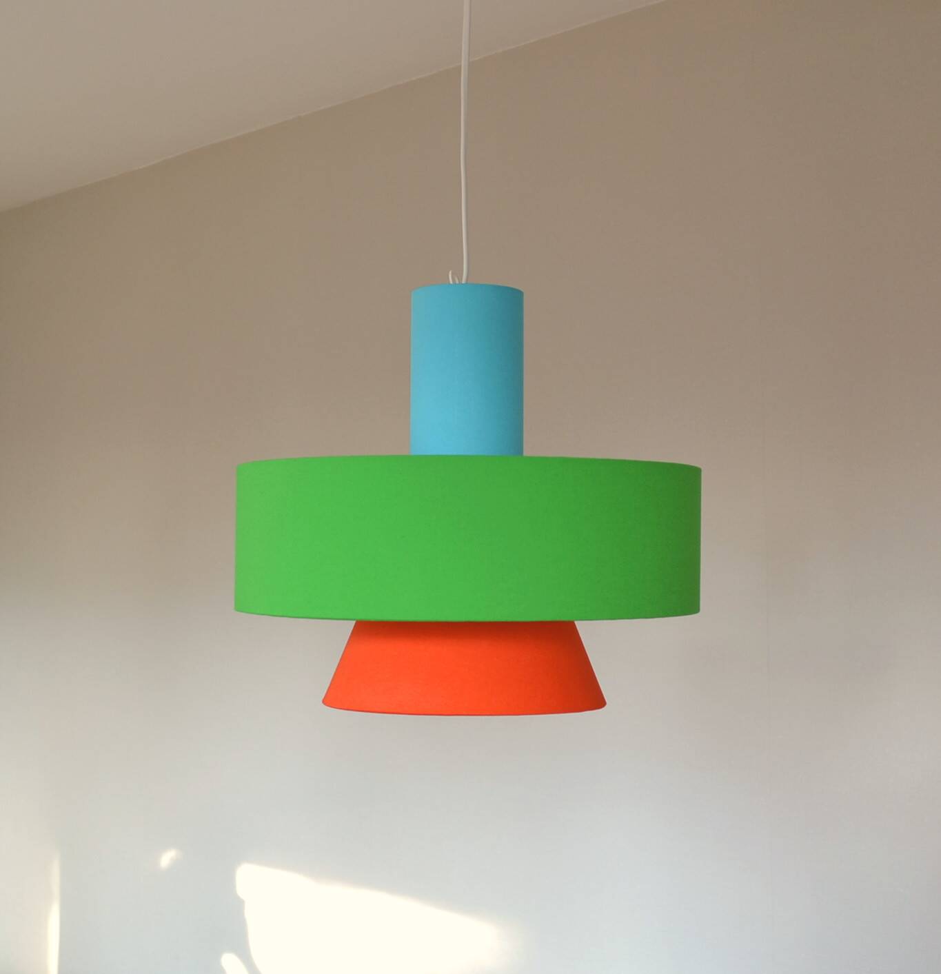 Gravity pendant lamp - sleek design in coloured fabric