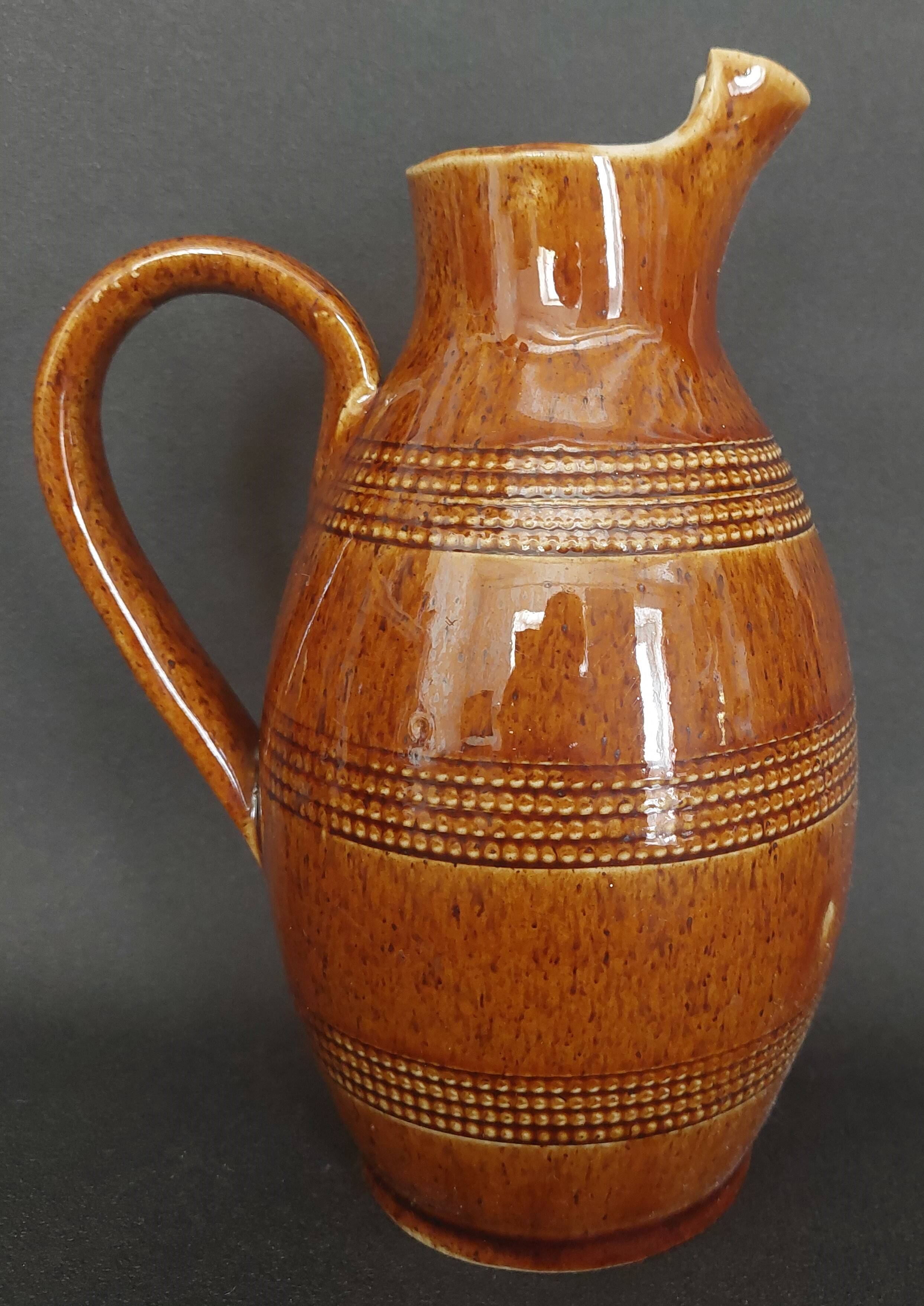 Mid-20th century brown glazed stoneware wine pitcher