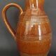 Mid-20th century brown glazed stoneware wine pitcher