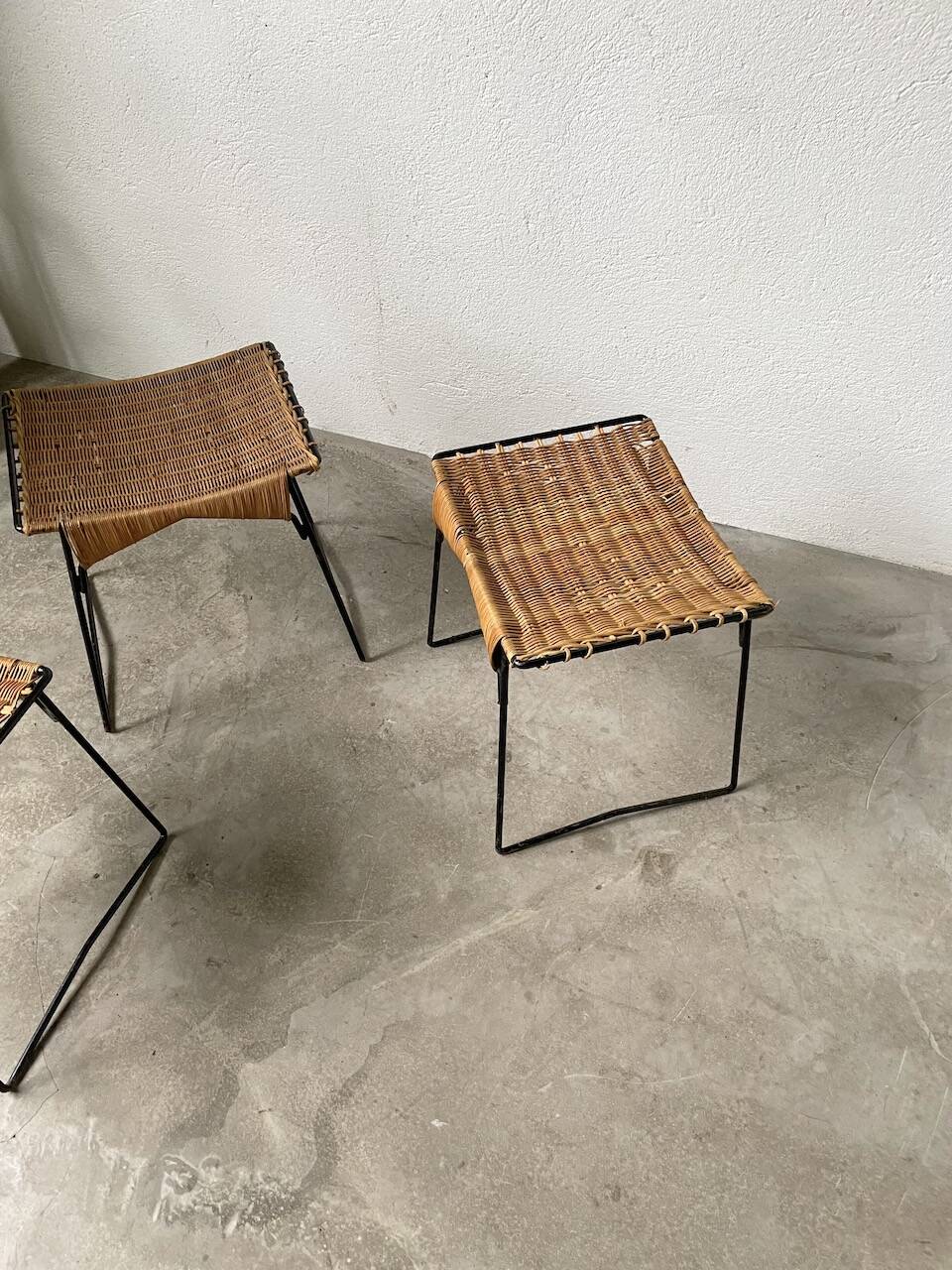 Set of three Raoul Guys wicker and metal stools