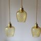 Trio of yellow glass pendant lights