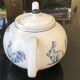 White porcelain teapot decorated with animals
