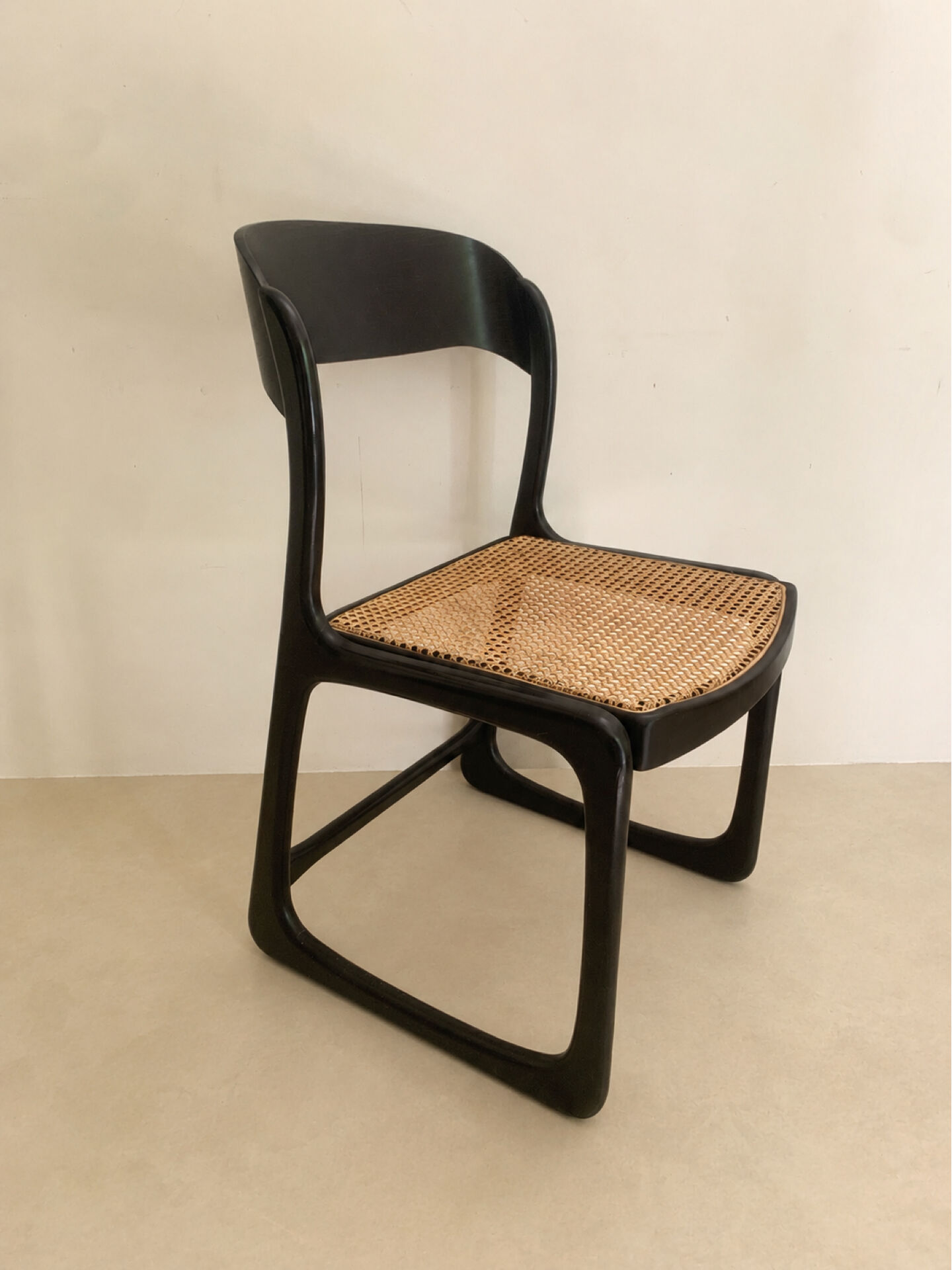 Set of 4 Baumann sled chairs with caning.