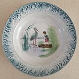 Serving dish iron earth decorated with child and stork decoration