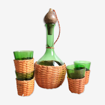 Service carafe and vintage glasses, with wicker