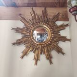 Sun mirror and witch's eye in gilded wood