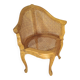 Armchair in solid oak with caning and a central leg (known as couillard), 89x68cm.