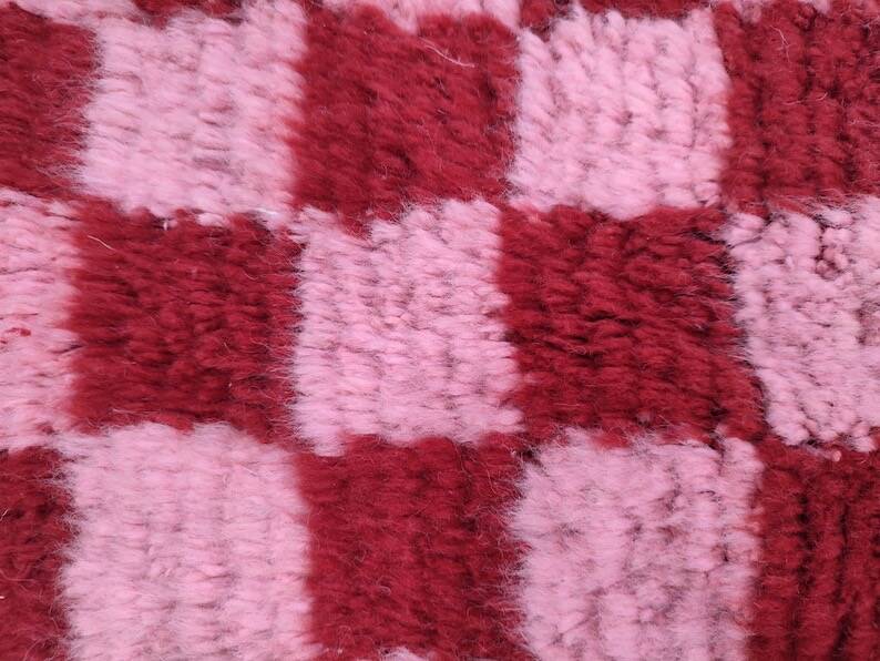 Handmade pure wool rug in traditional pink and red, 150/250 cm.