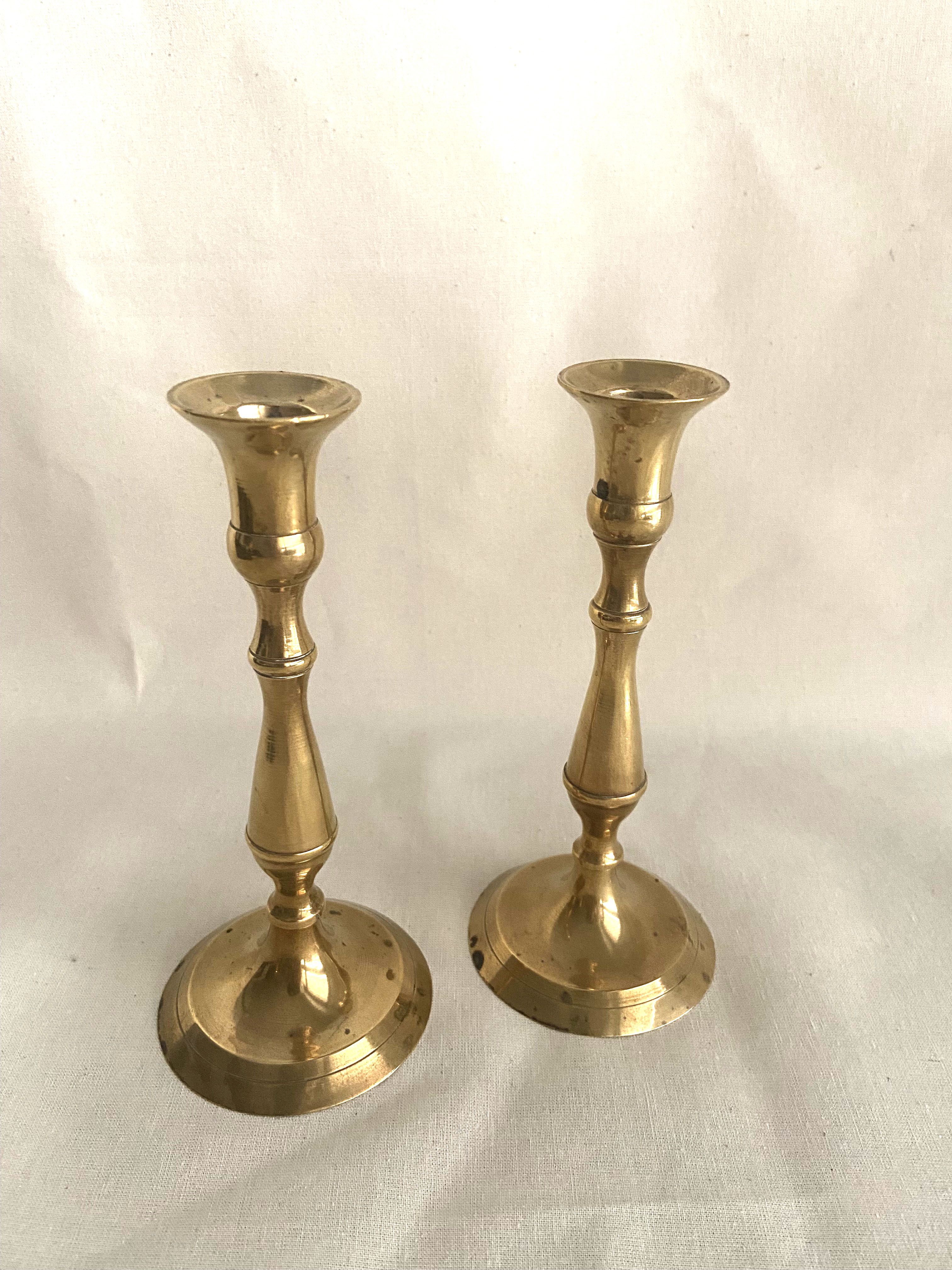 Duo of brass candle holders