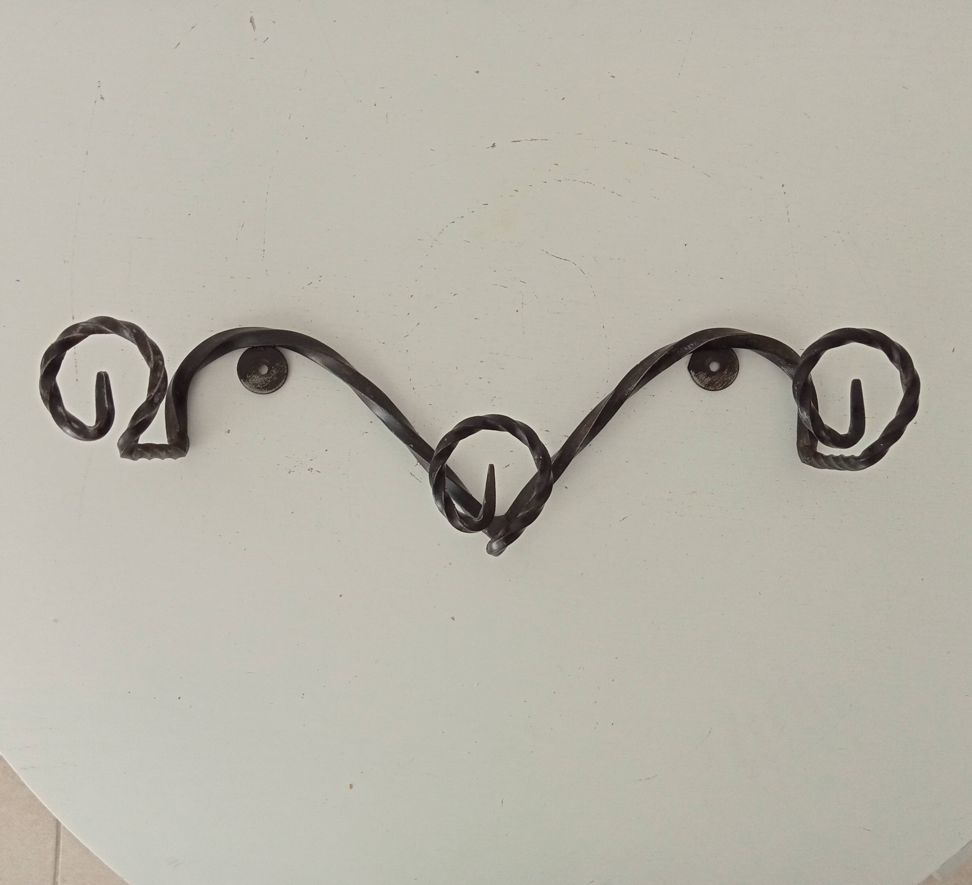 Vintage wrought iron wall coat rack