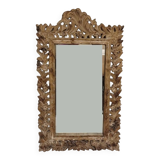Mirror with its openwork frame
