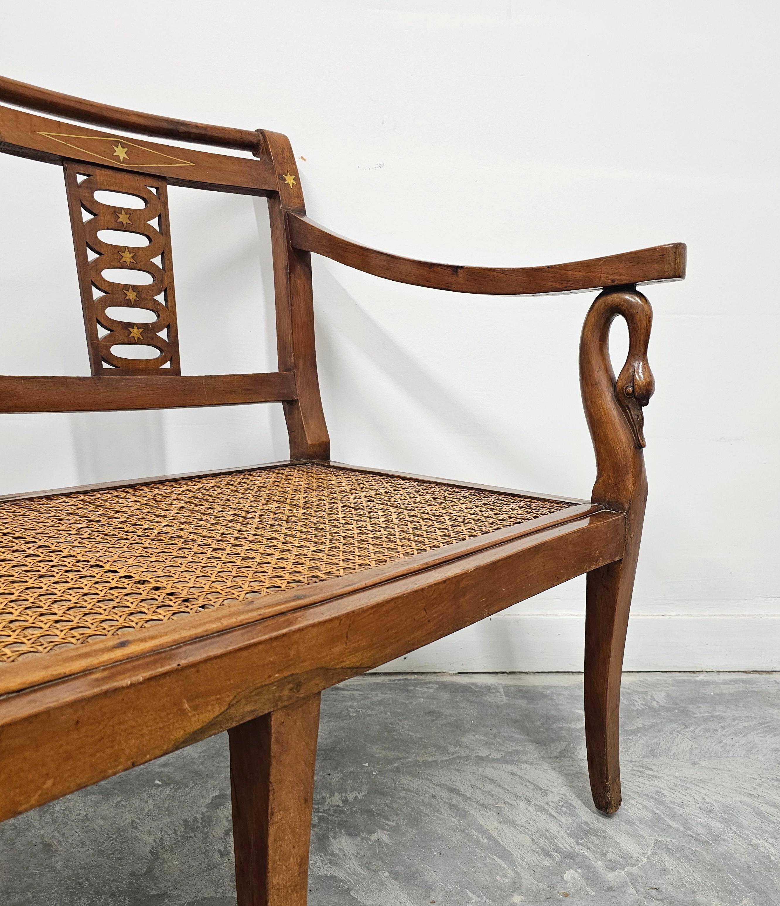 Directoire canapé in walnut with brass inlays, late 18th century.