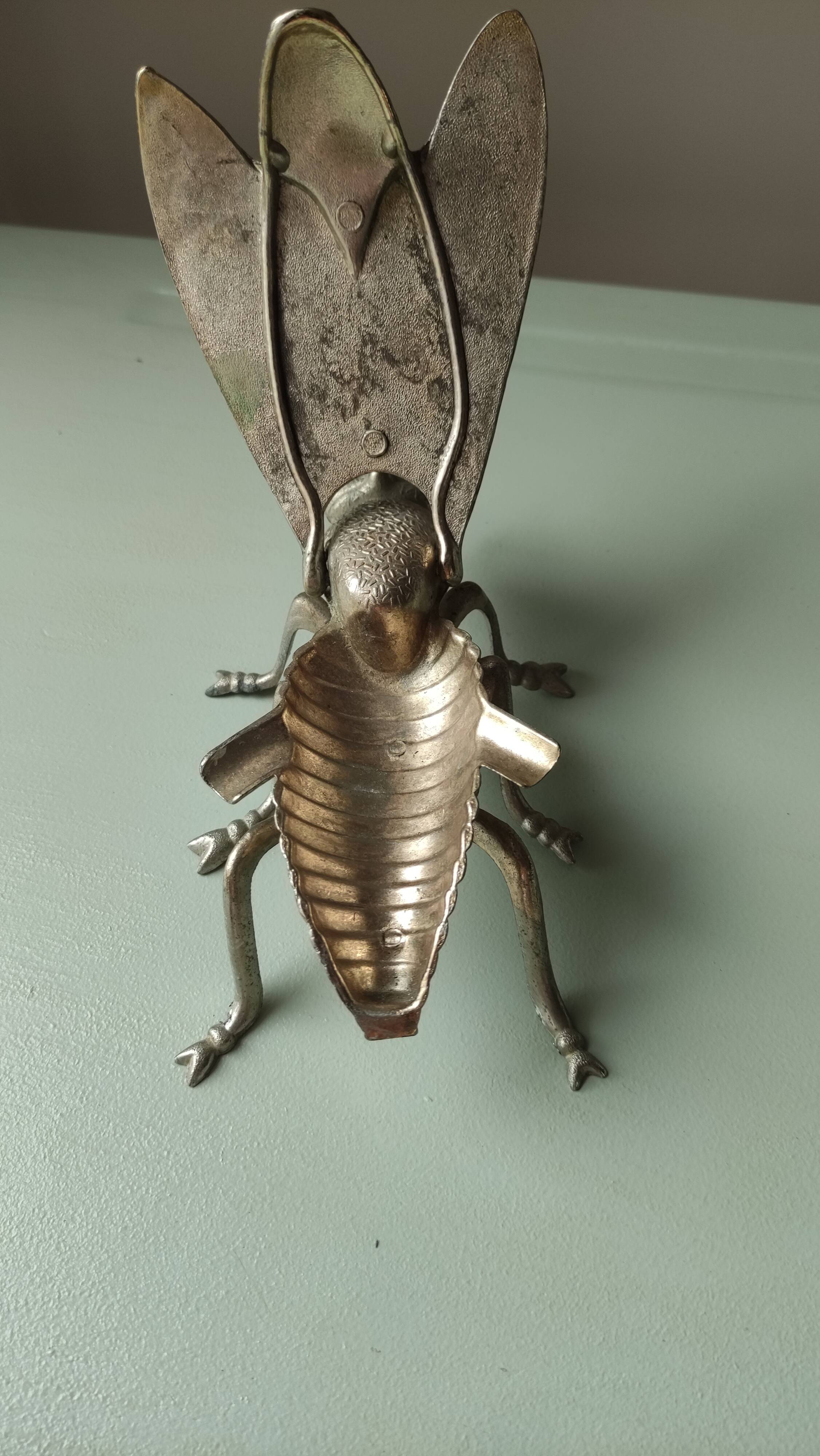 Vintage metal fly, old ashtray to divert