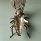 Vintage metal fly, old ashtray to divert