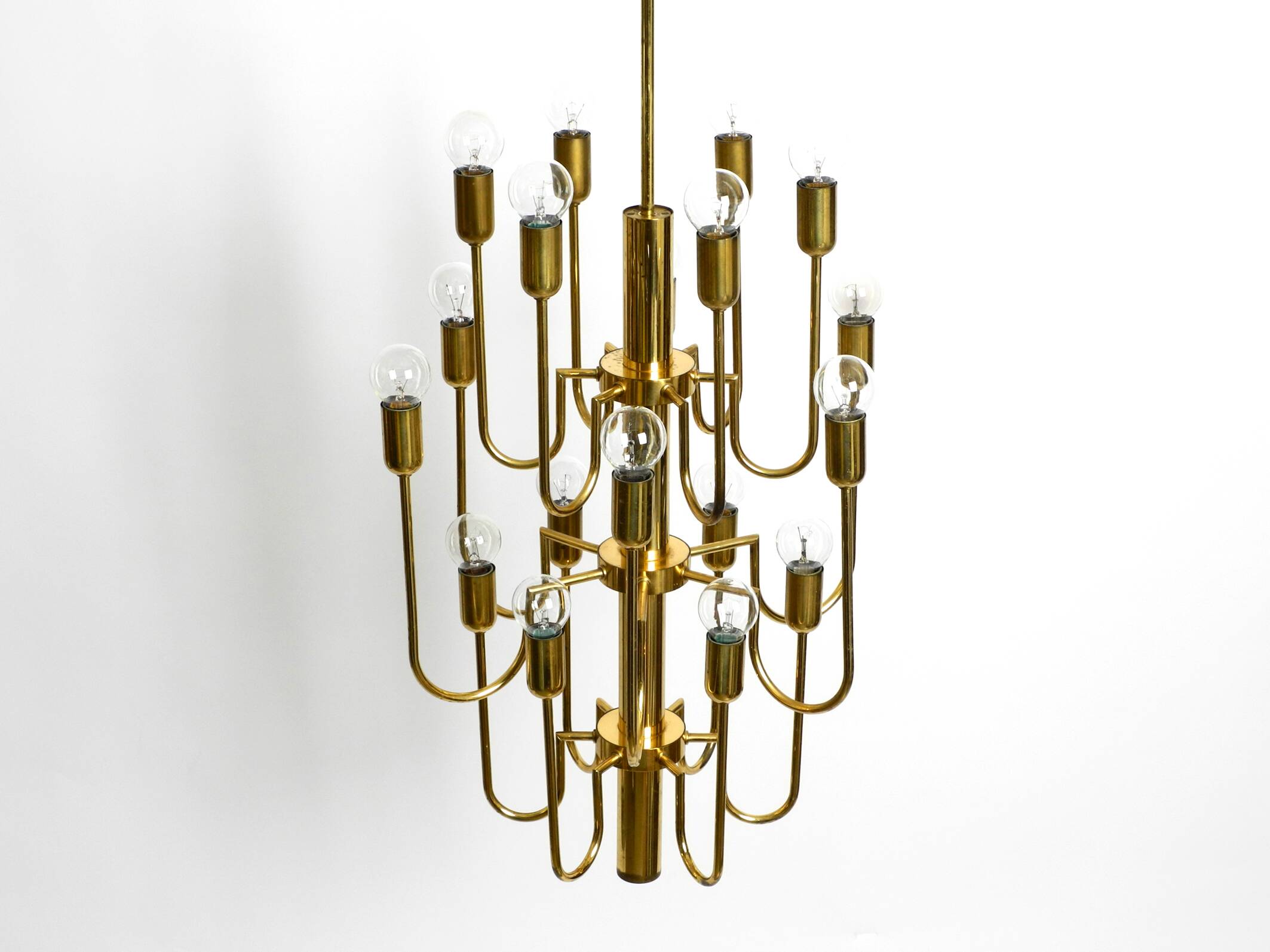 Three staged 18 arm Mid Century brass chandelier with a long brass rod